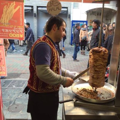 man cutting kebab