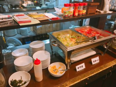 Salad, minum, and dessert in buffet style
